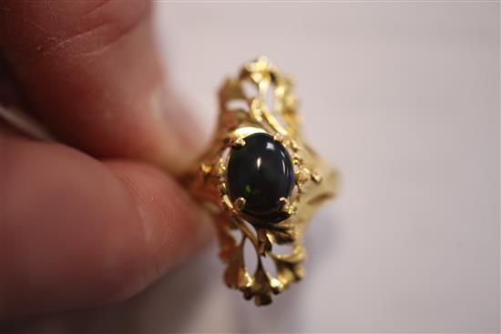 A French 18ct gold and black opal up-finger ring, size N.